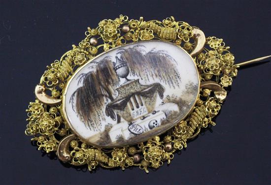 A 19th century gold oval mourning brooch with inset ivory panel, 2.5in.